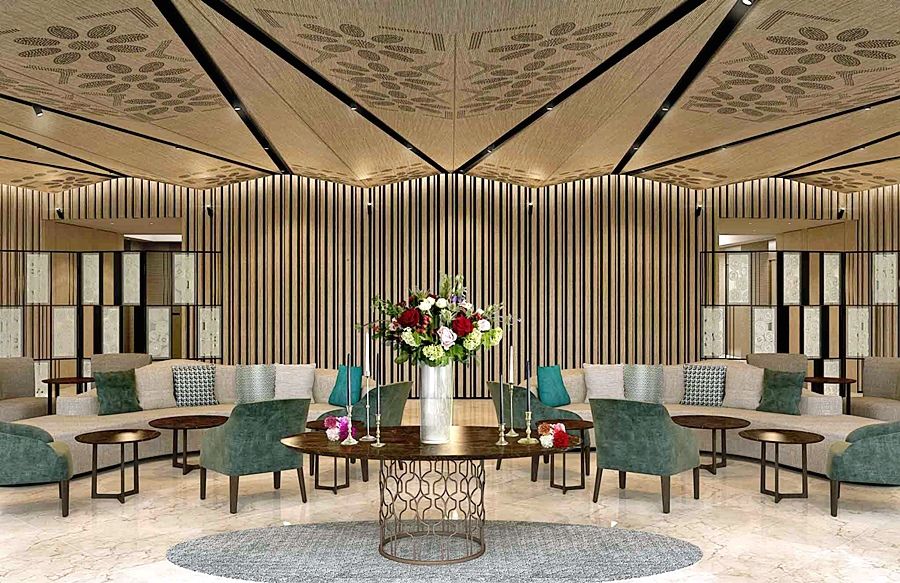 Eurostars Torre Sevilla Esterno foto The photo depicts a stylish and modern lounge area. The interior features a sophisticated design with a high ceiling adorned with a decorative pattern. It includes multiple seating arrangements consisting of comfortable chairs and sofas in shades of 